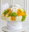 Arreglo floral de lujo en amarillo, blanco y verde con rosas, hortensias y orquídeas en Miami