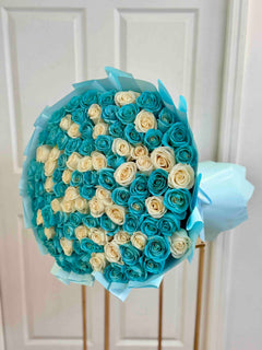
                    
                      Luxury Tiffany blue and white rose bouquet featuring premium long stem roses in elegant blue wrapping.
                    
                  