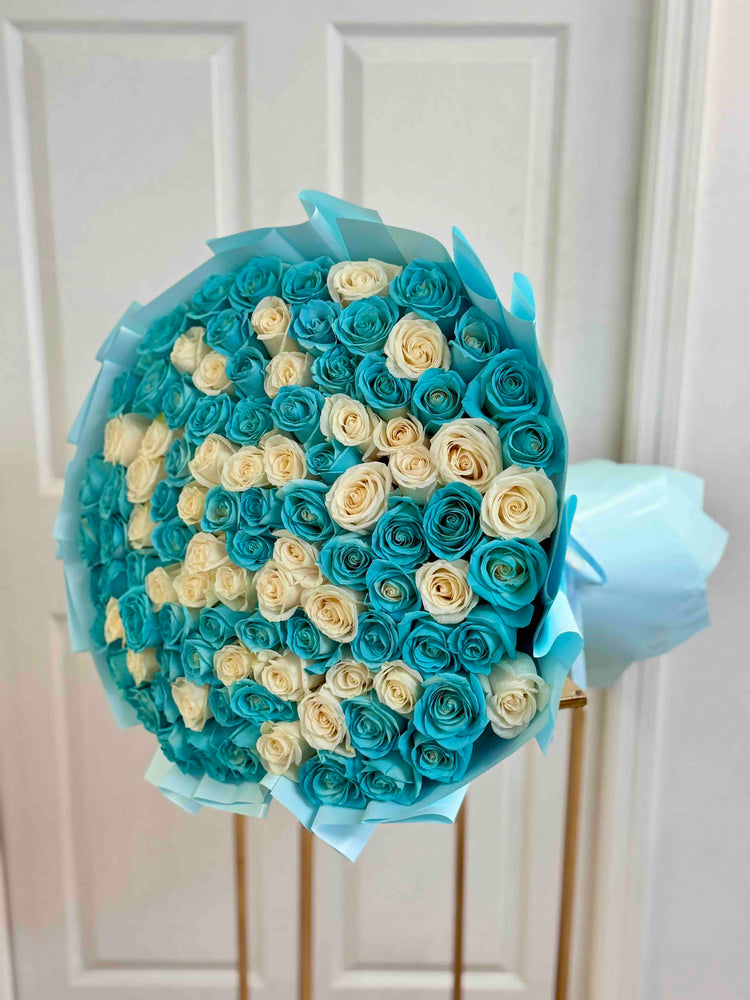 Luxury Tiffany blue and white rose bouquet featuring premium long stem roses in elegant blue wrapping.