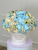 blue and white flowers in luxury hat box
