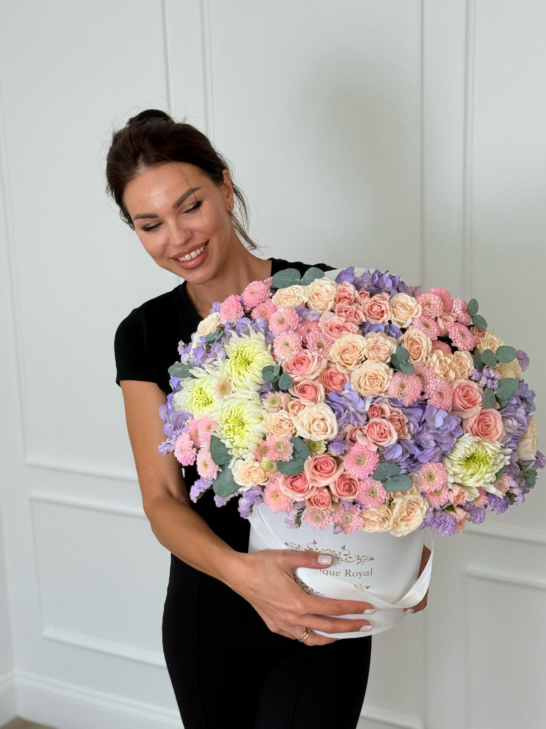 florist holding le boutique royal flowers