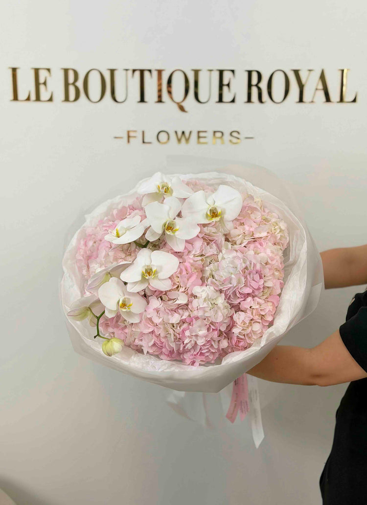 Luxury bouquet of blush pink hydrangeas and cascading white phalaenopsis orchids