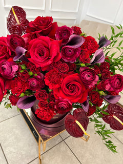 
                    
                      red roses and other flowers
                    
                  