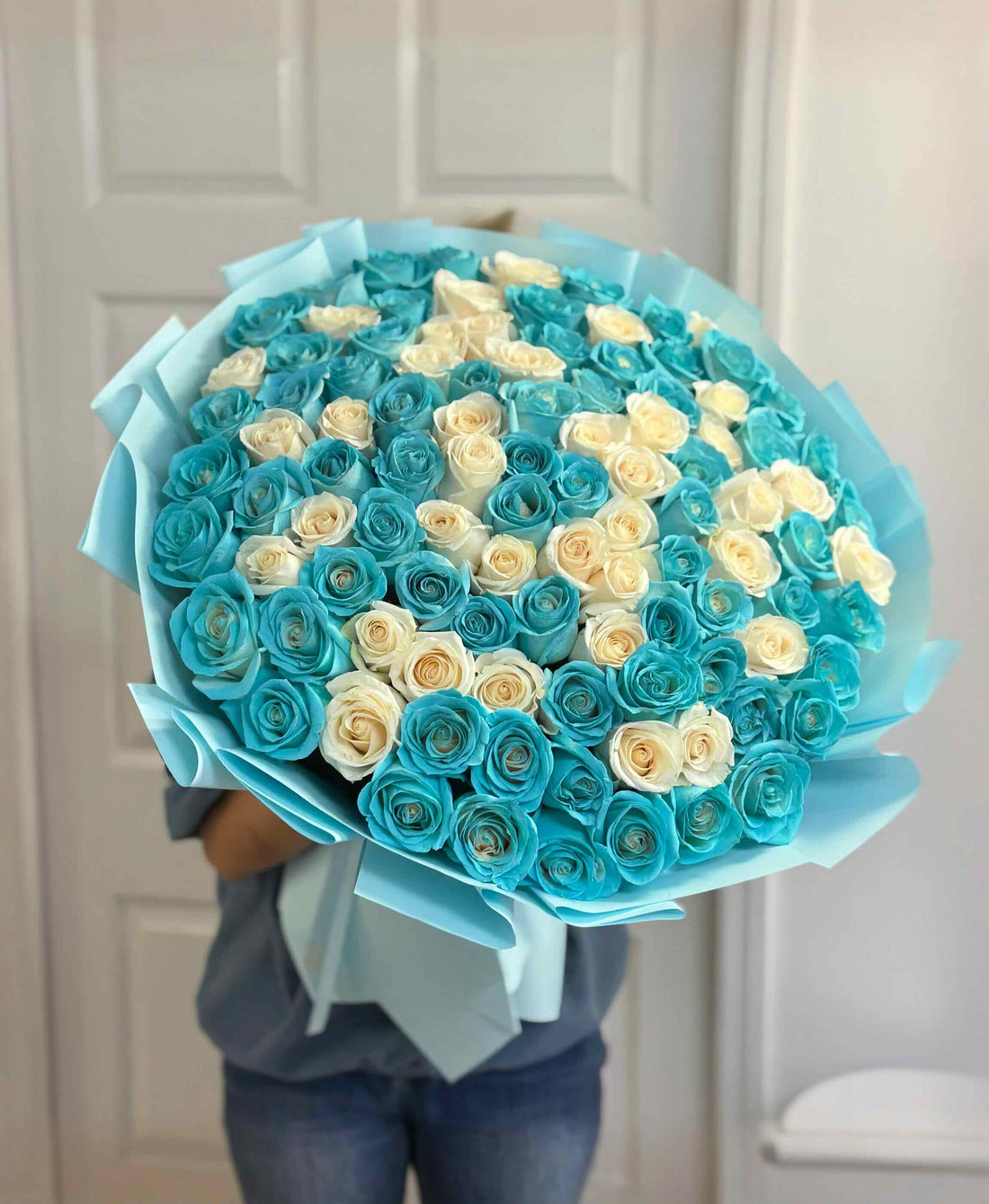Luxury Tiffany blue and white rose bouquet featuring premium long stem roses in elegant blue wrapping.