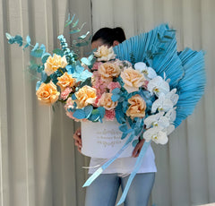 
                    
                      Blue and Peach Mix of Blooms
                    
                  