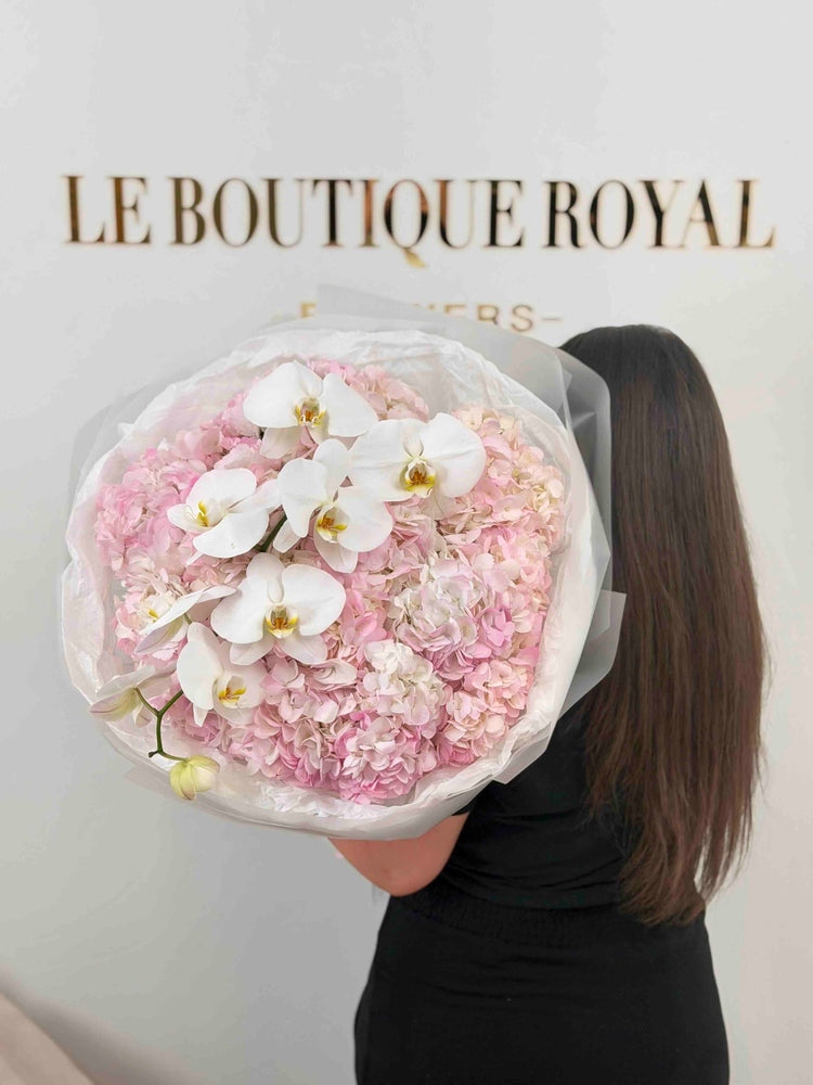 Luxury bouquet of blush pink hydrangeas and cascading white orchids