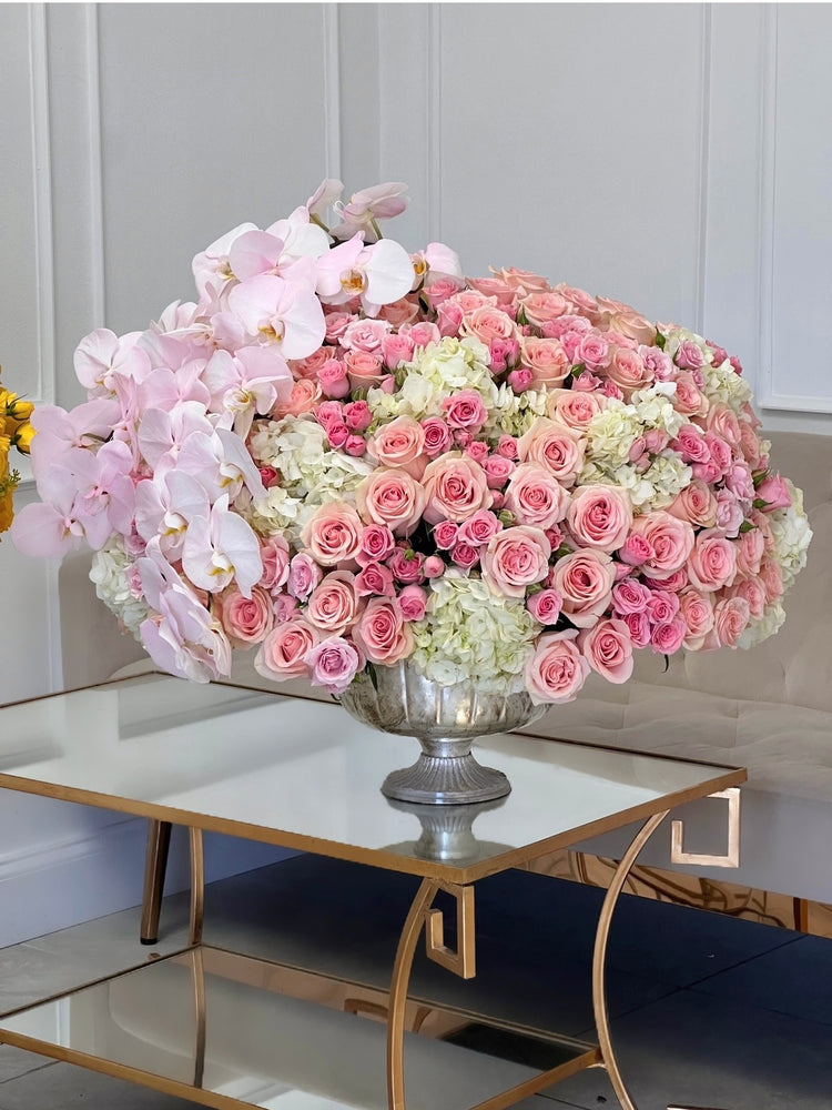 pink flowers with orchids in a vase large