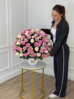 
                    
                      Pink and White Roses in Elegant Vase
                    
                  