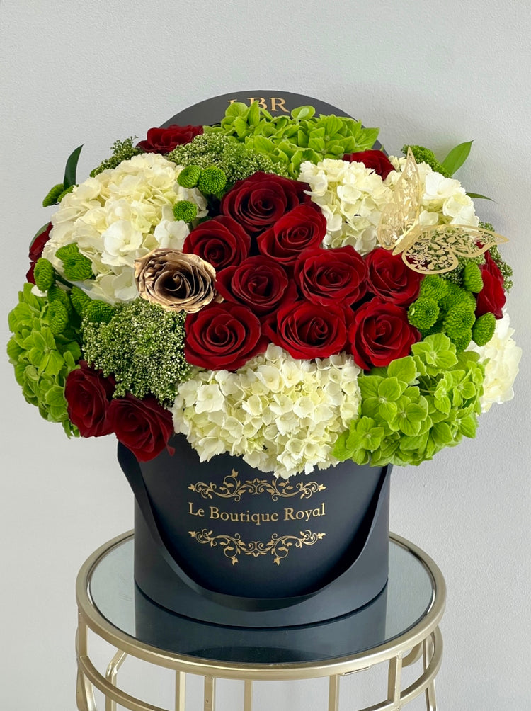 green and red flowers in a vase
