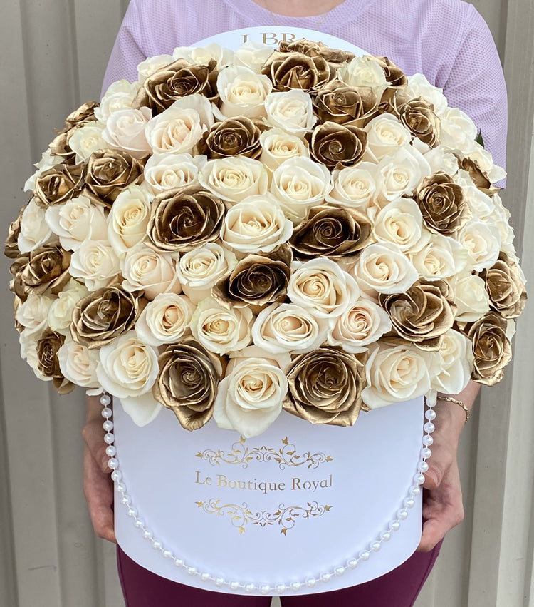 white and gold roses
