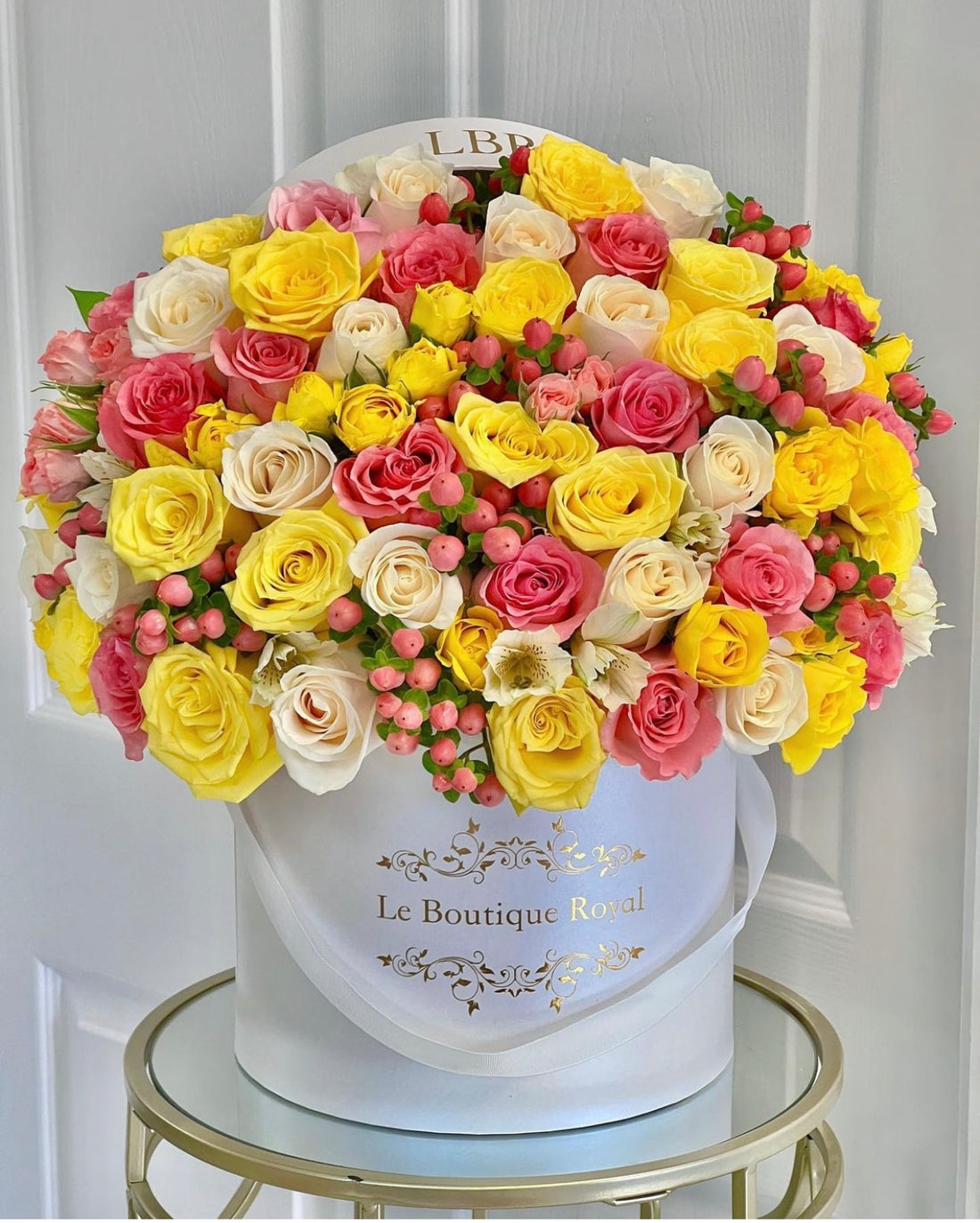 yellow flowers with pink berries