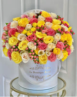 yellow flowers with pink berries