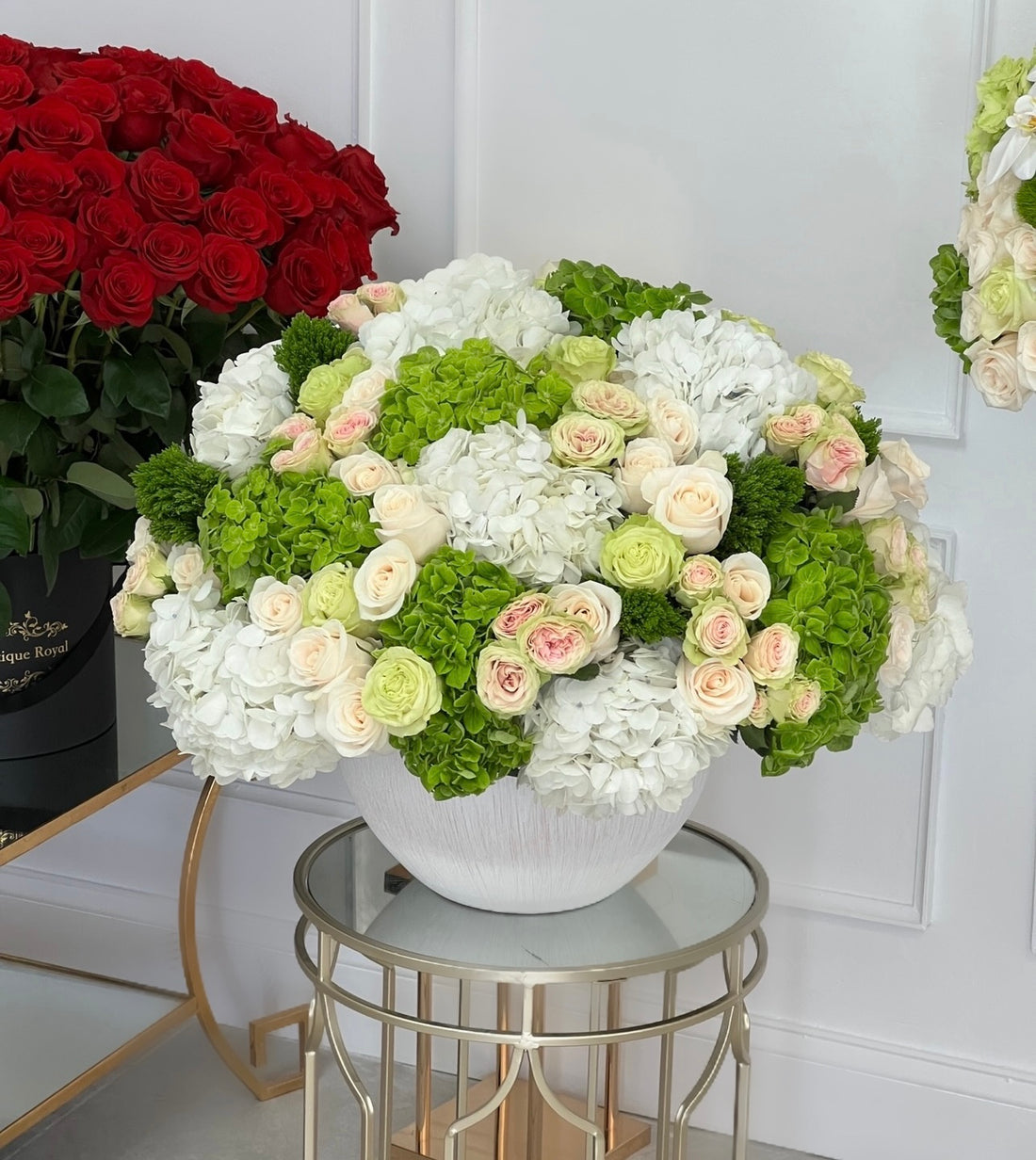 green and white flowers in a vase
