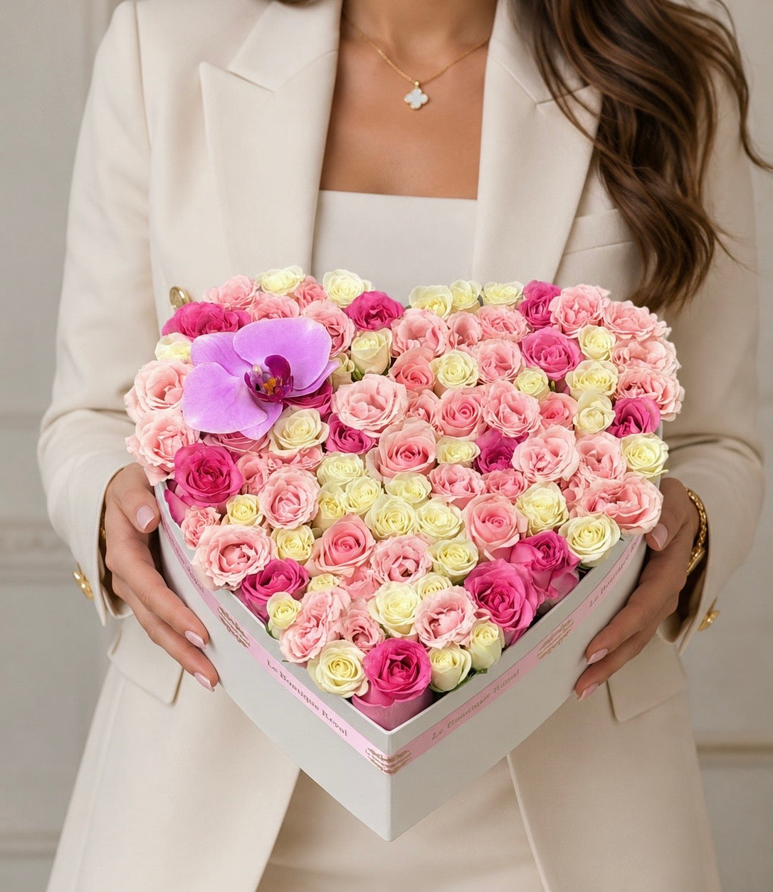 Luxury heart-shaped flower box with pink and white roses and a purple orchid by Le Boutique Royal in Miami.