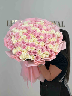 
                    
                      Luxury bouquet of blush pink and ivory garden roses wrapped in elegant pink paper, handcrafted by Le Boutique Royal.
                    
                  