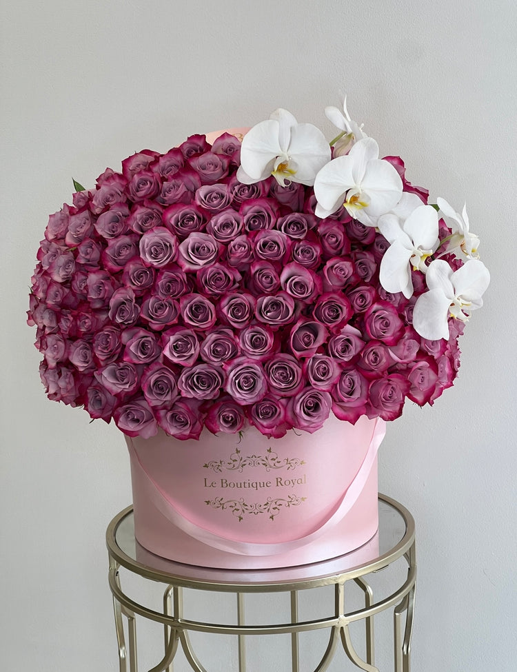 purple roses with orchids