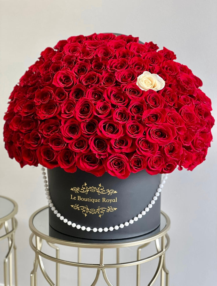 100 red roses in a luxury shop