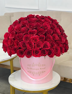 
                    
                      50 rosas rojas en una sombrerera
                    
                  