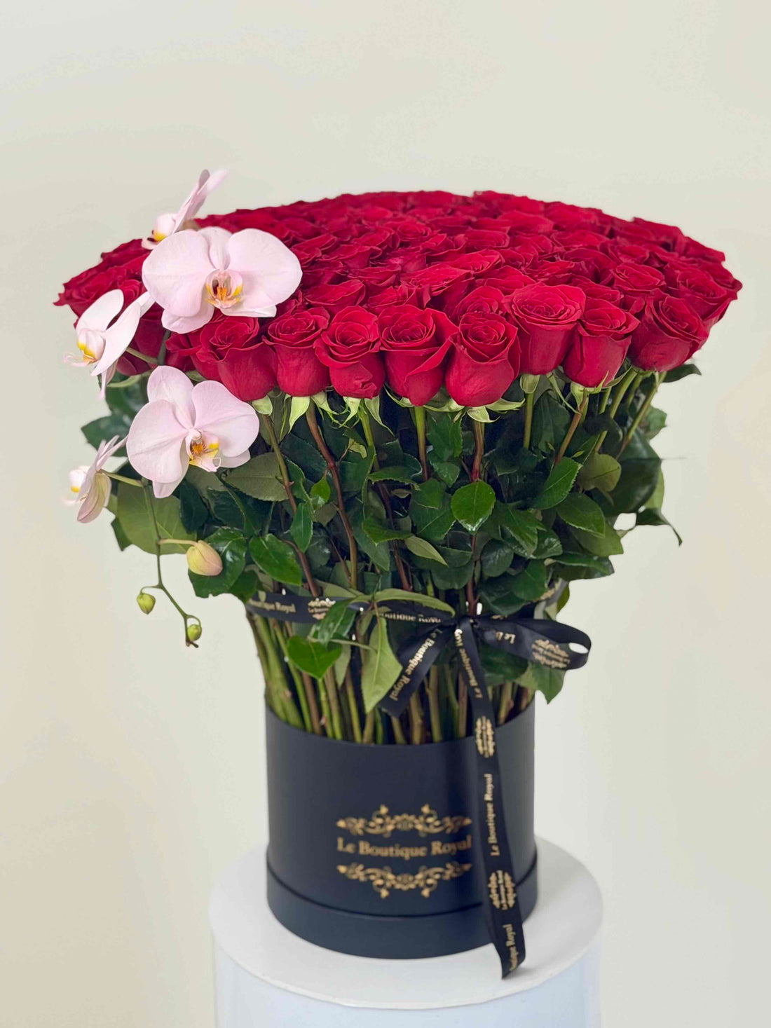 long stem red roses with orchids by Le Boutique Royal Flower shop in Miami