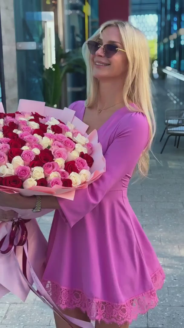 Happy customer with  pink Le Boutique Royal flower bouquet
