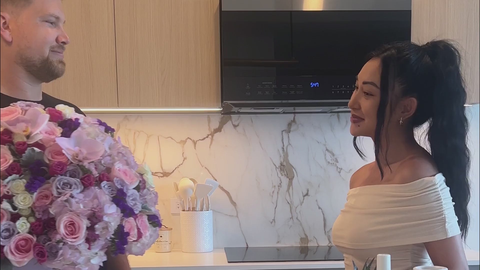 A happy couple receiving Le Boutique Royal Flowers video 